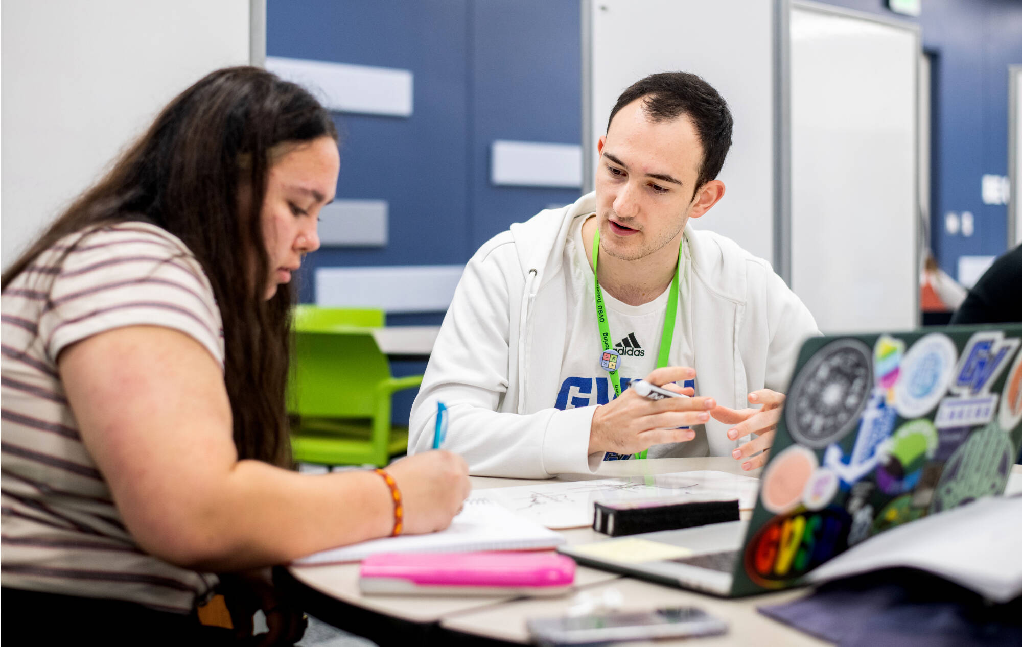 Pablo Kohlmann Garcia, right, tutors Tara Barnett, left, in the new Tutoring and Reading Center in Henry Hall September 27.(Photo releases on file)